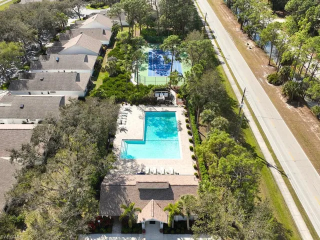 Community amenities feature a sparkling pool and serene green spaces.