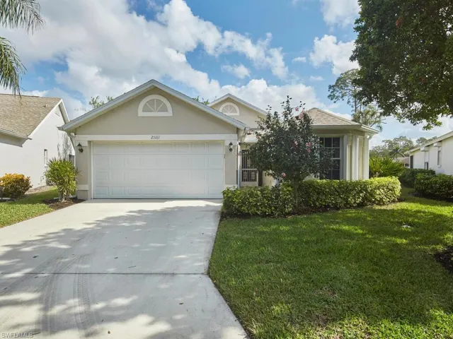 Beautiful curb appeal with a well-maintained lawn and inviting entrance.