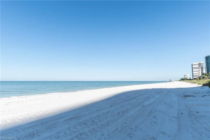 Property view of water featuring a beach view