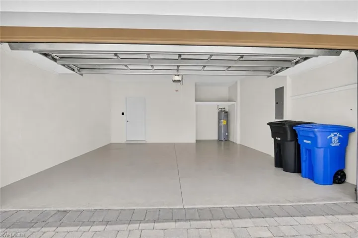 This photo has been digitally altred to remove items on the floor of the garage and to better represent the size of the garage