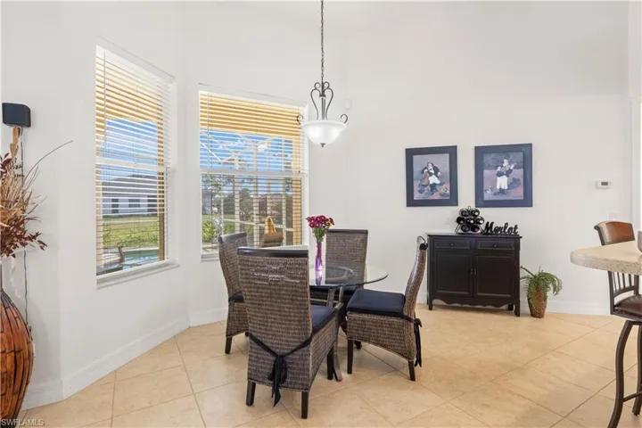 Dining space featuring baseboards and light tile patterned floors