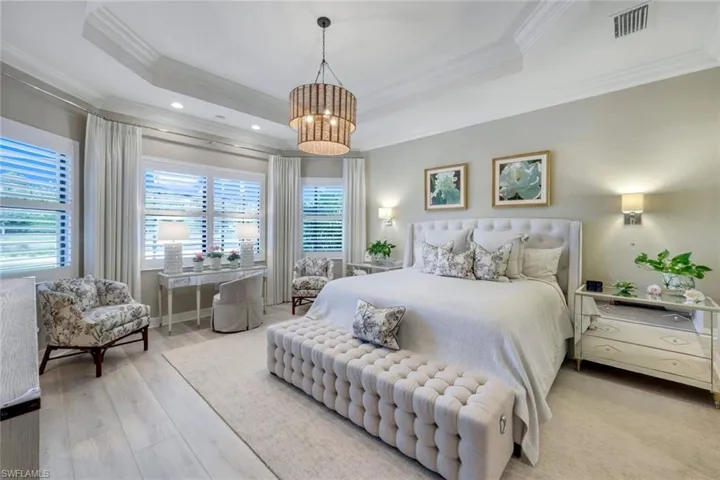 Soothing Primary Suite with views of the landscapes and lake beyond