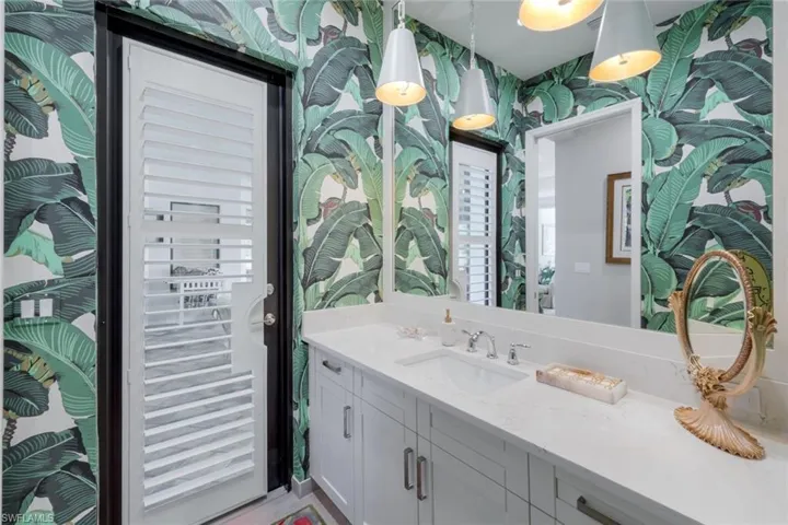 Powder and Pool Bath features the high end celebrity "Beverly Hills Banana Leaf" wallcovering!