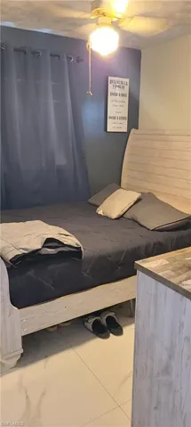 Bedroom featuring a ceiling fan