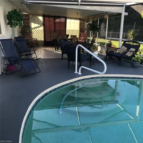 Outdoor pool featuring outdoor lounge area and a patio area