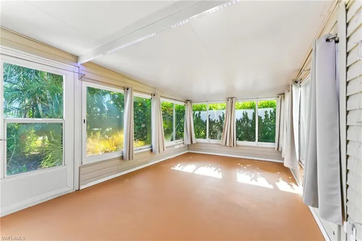 Unfurnished sunroom with plenty of natural light