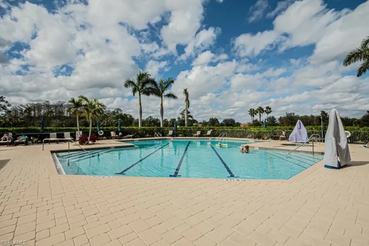 Community pool with a patio area