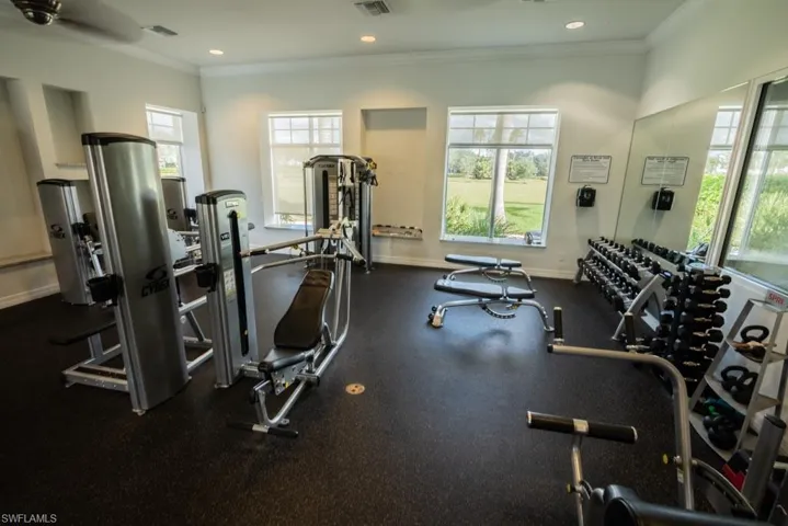 Gym featuring crown molding and recessed lighting