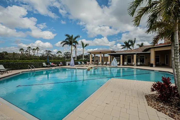 Community pool featuring a patio
