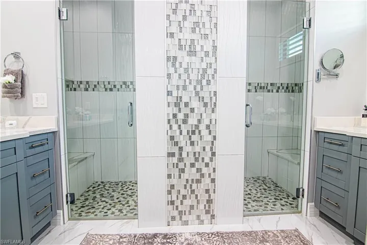 Bathroom with an enclosed shower and vanity