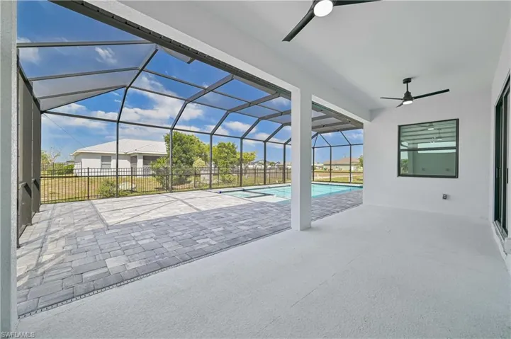View of swimming pool with a ceiling fan, a patio area, fence, a lanai, and a fenced in pool