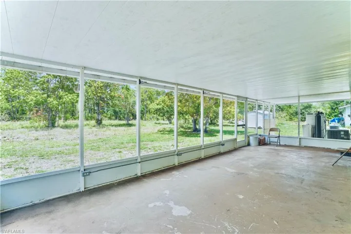 Unfurnished sunroom featuring plenty of natural light