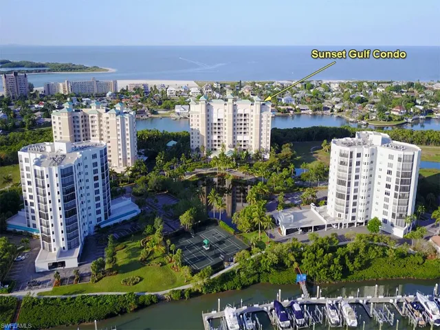 Drone / aerial view of a large body of water and apartment complex