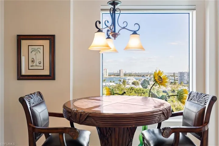 Dining space with a chandelier and baseboards