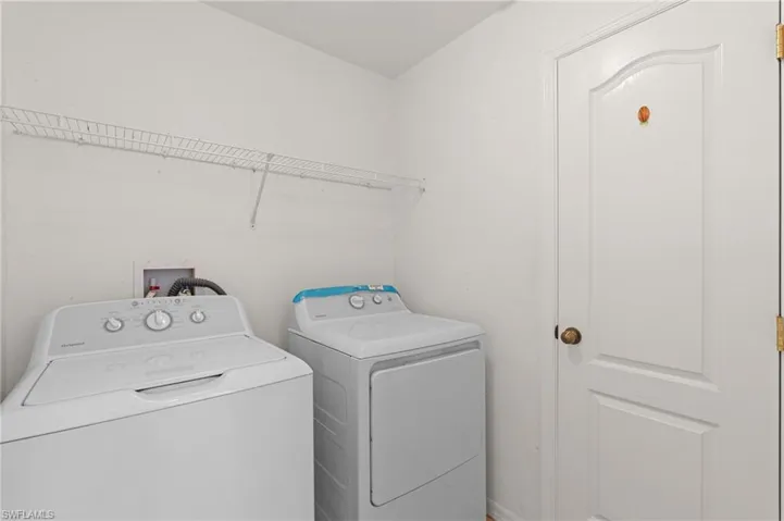 Laundry area with washing machine and clothes dryer