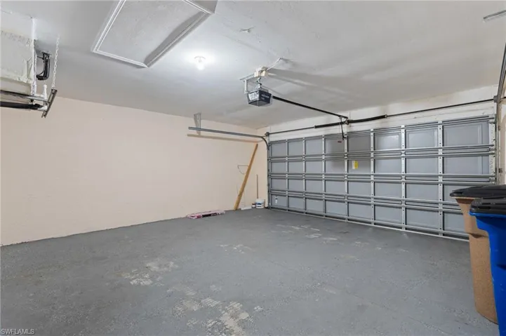 Garage featuring a garage door opener