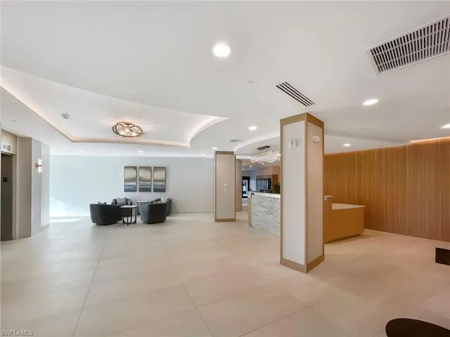 Lobby with recessed lighting and wood walls