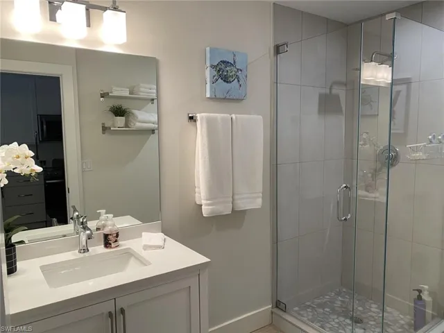 1st floor Full bathroom featuring vanity and a shower stall
