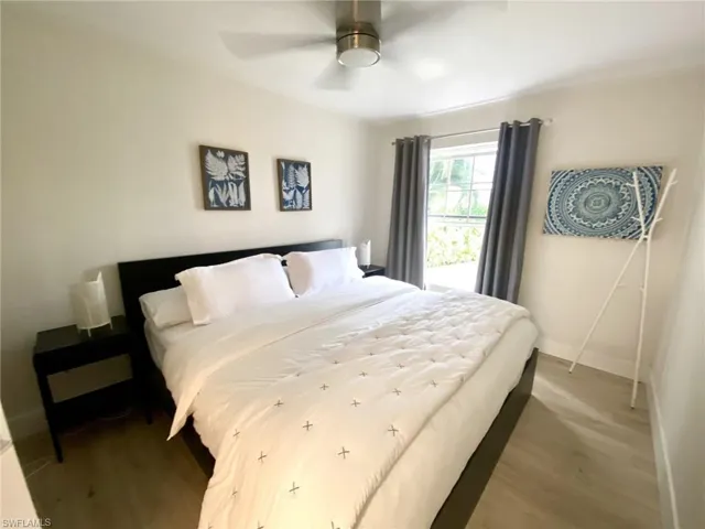 1st floor Bedroom with wood finished floors and a ceiling fan