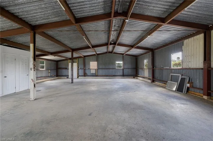 Garage featuring metal wall