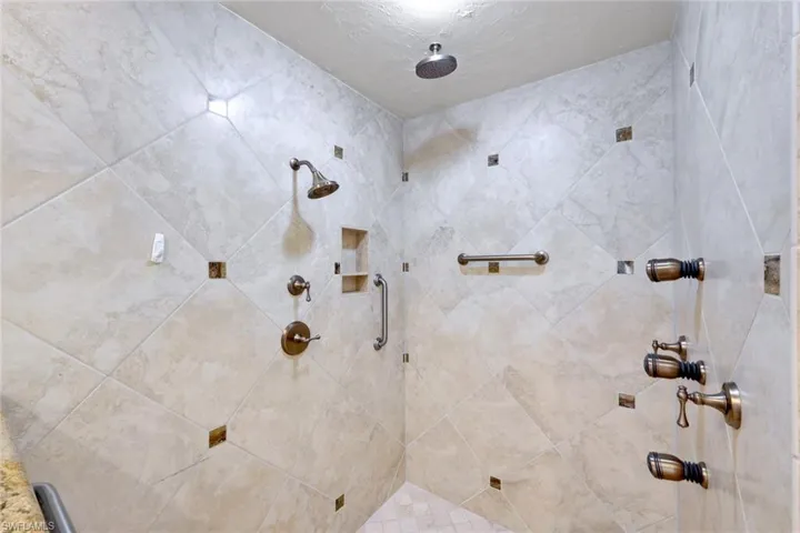 Bathroom featuring a tile shower