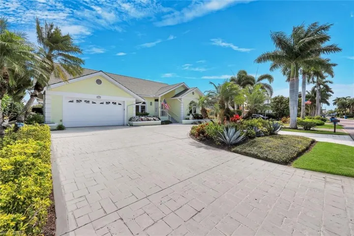 Ranch-style home featuring driveway and a garage