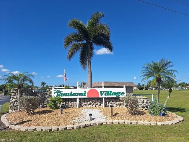 Community sign featuring a lawn