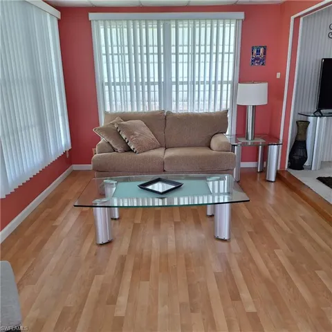 Living room featuring plenty of natural light and light hardwood / wood-style floors