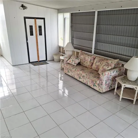 Living room featuring light tile patterned floors
