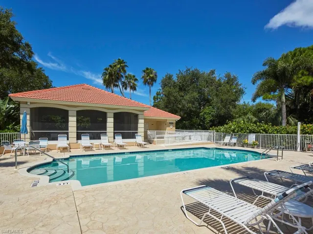 Community pool with a patio area