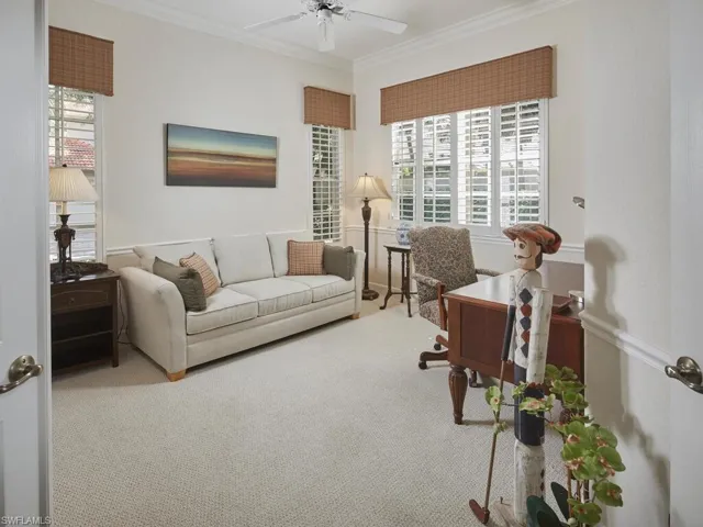 Carpeted office with crown molding
