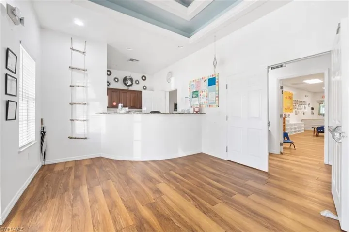 Unfurnished living room featuring wood finished floors