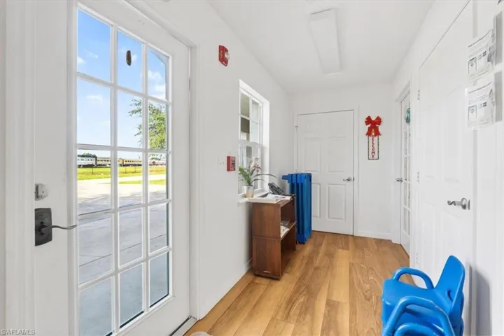Entryway featuring wood finished floors and baseboards
