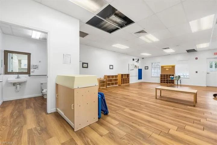 Miscellaneous room featuring a paneled ceiling and a sink