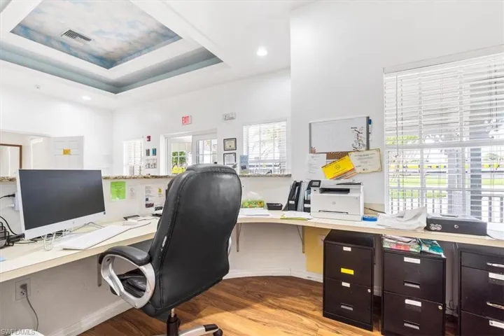 Office featuring recessed lighting and a raised ceiling