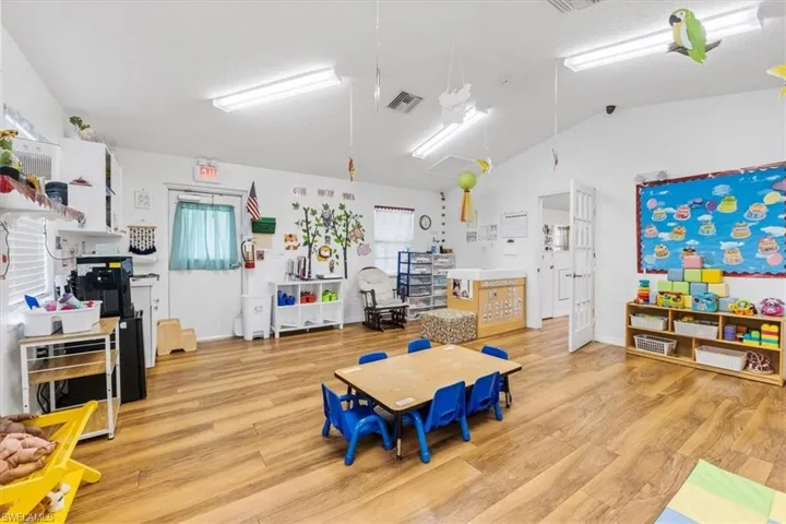 Game room featuring vaulted ceiling