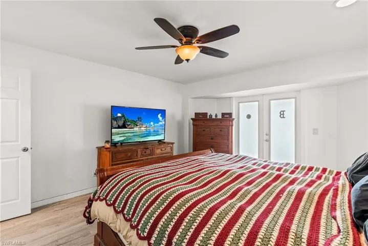 Master bedroom, with french doors private entrance to lanai with pool