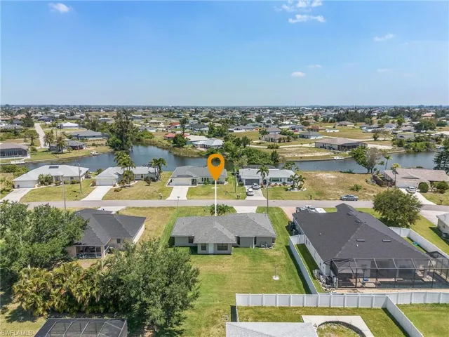 Canal and aerial house & yard back