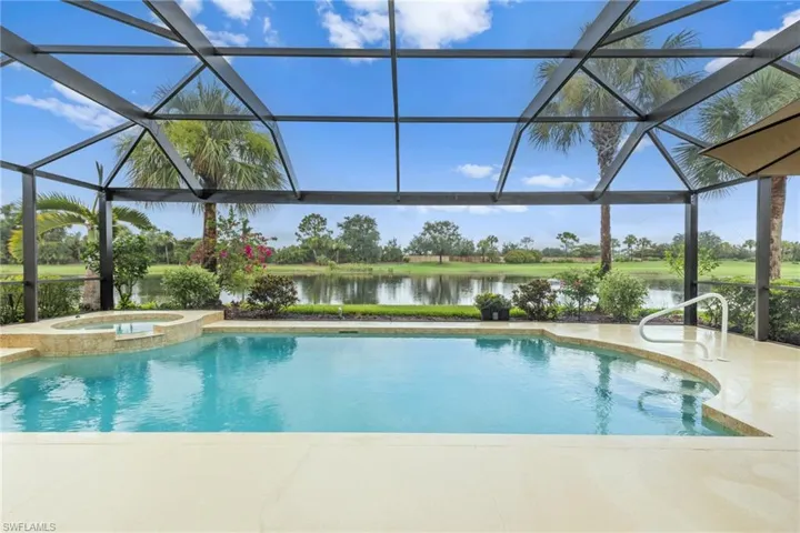 Breathtaking view of lake and golf from your spacious lanai with new picture window screen