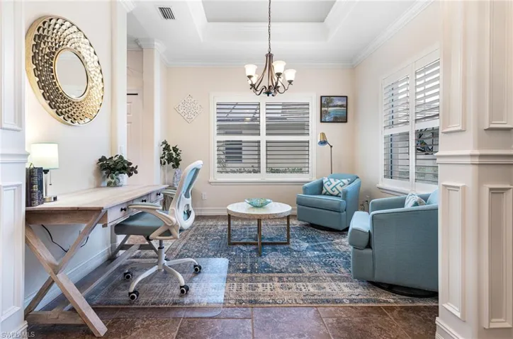 Flex room with plantation shutters and tray ceiling