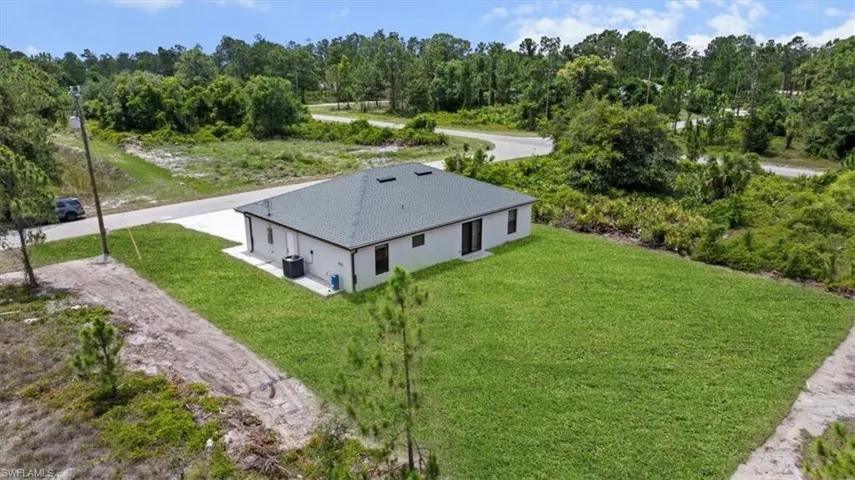 View of subject property featuring a forest