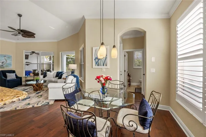 Breakfast nook looking to family room & hall to pool bath