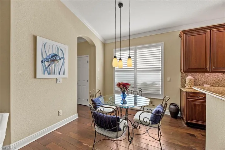Breakfast nook, pantry behind door to left of archway