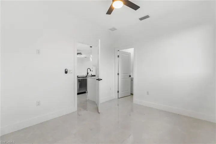 Unfurnished bedroom featuring baseboards and ceiling fan