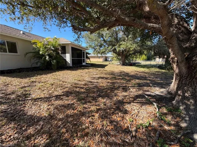 View of yard featuring a sunroom
