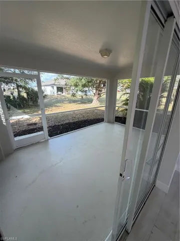 Unfurnished sunroom with plenty of natural light