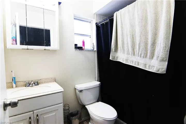 Bathroom with vanity and toilet