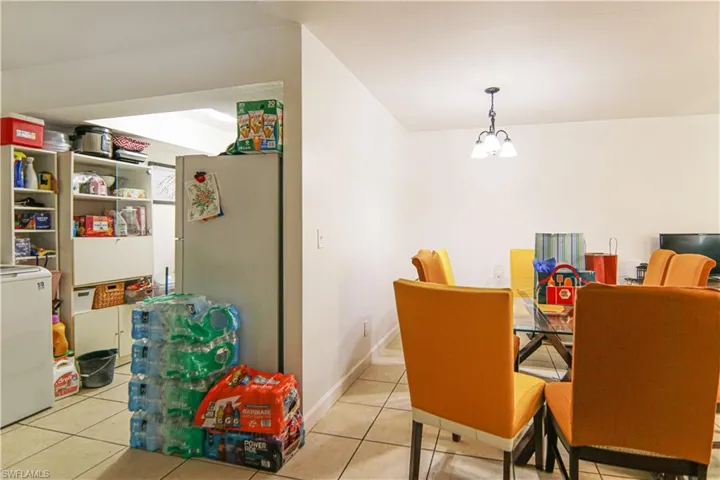 Dining space with tile patterned flooring and washer / clothes dryer