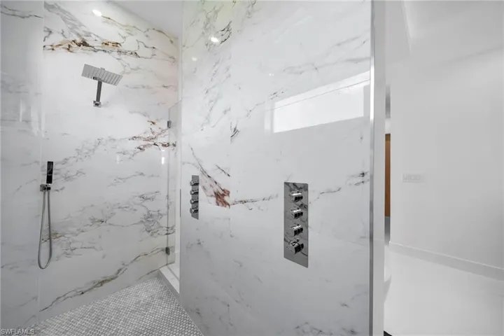 Bathroom featuring a tile shower