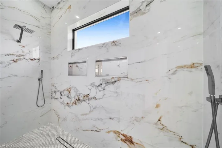 Bathroom featuring a tile shower